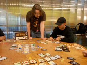 Peter and a PAX Enforcer play Munchkin quest.